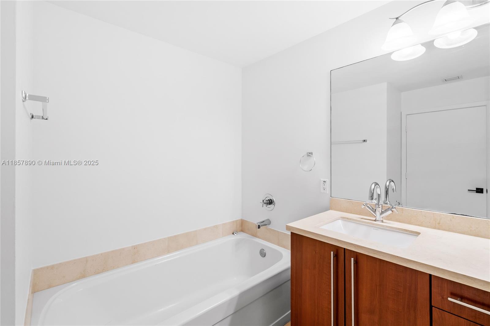 1111 Southwest 1st Avenue, Unit 2222N Miami, FL 33130 - Photo 20 of 53 a bathroom with a sink and a bathtub