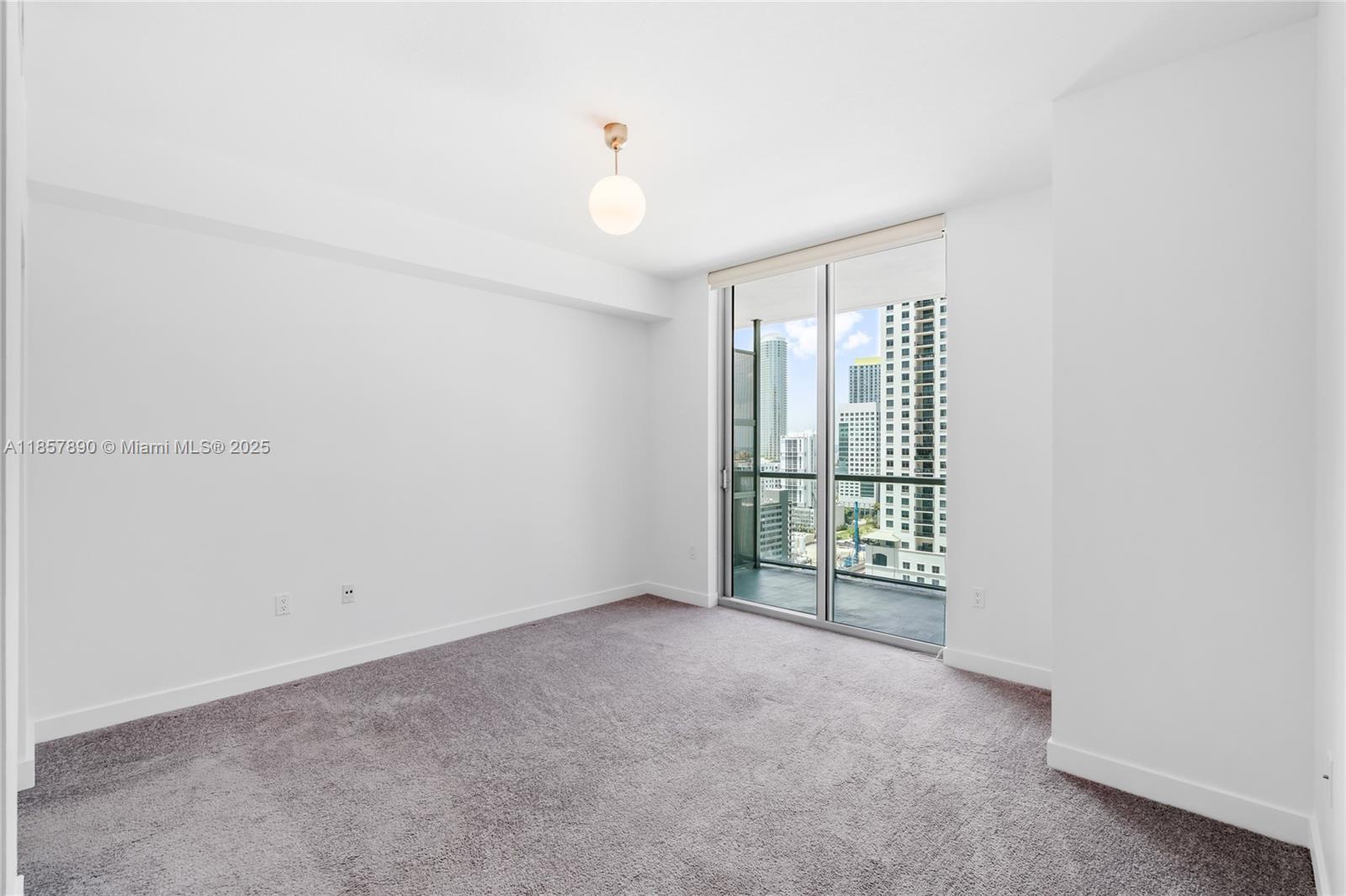 1111 Southwest 1st Avenue, Unit 2222N Miami, FL 33130 - Photo 25 of 53 a view of an empty room with a window