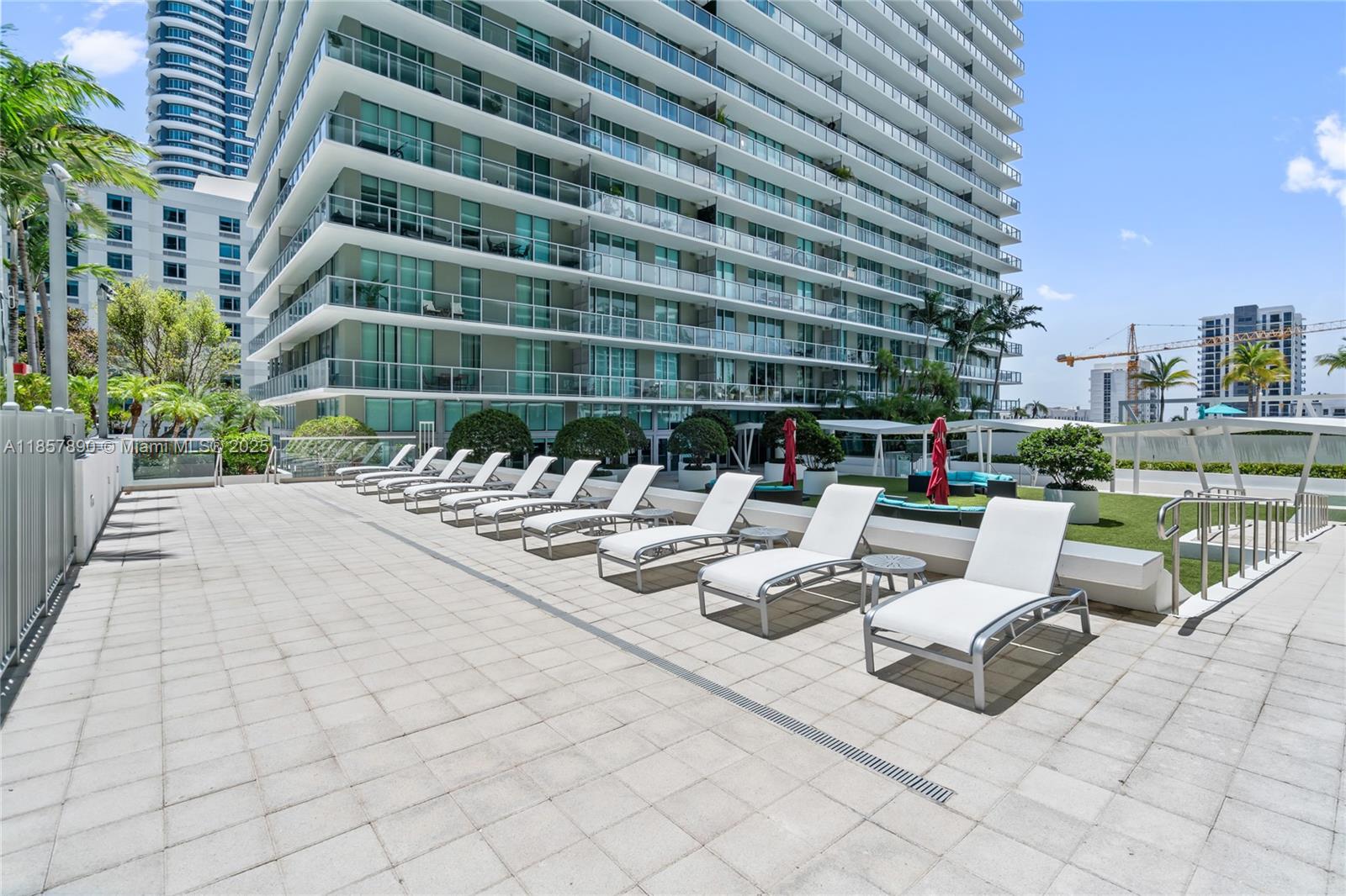 1111 Southwest 1st Avenue, Unit 2222N Miami, FL 33130 - Photo 34 of 53 a view of a patio with couches and potted plants
