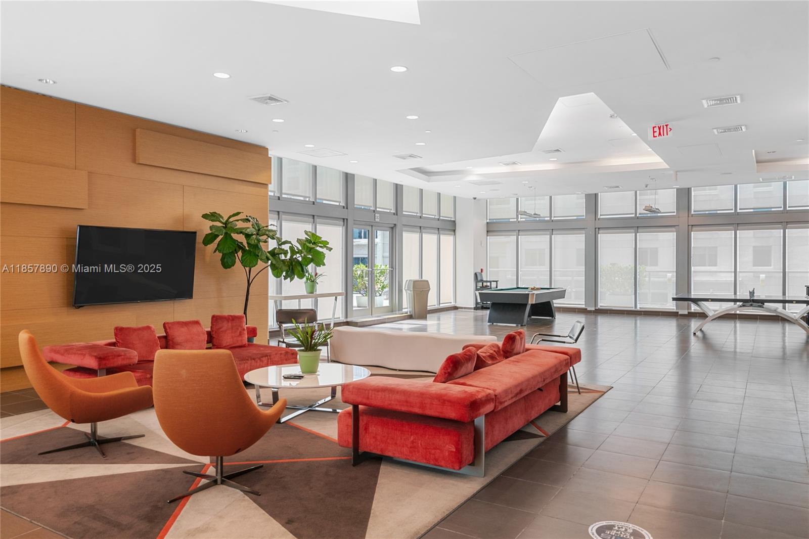 1111 Southwest 1st Avenue, Unit 2222N Miami, FL 33130 - Photo 40 of 53 a living room with furniture a window and a flat screen tv
