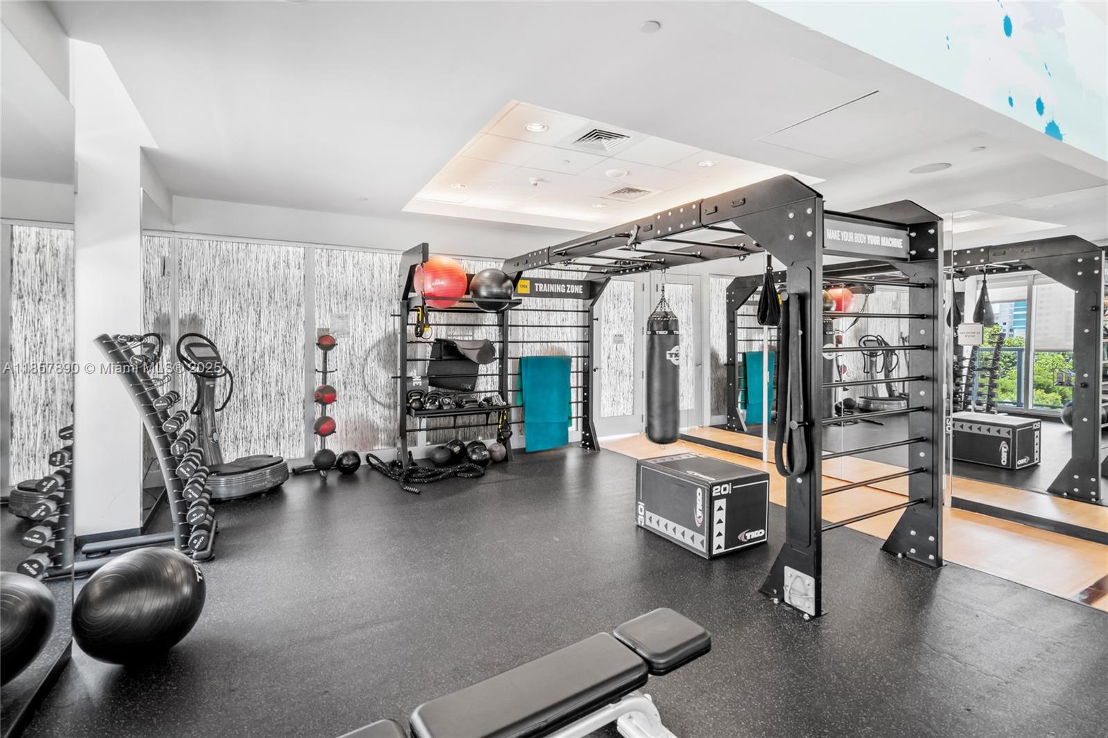 1111 Southwest 1st Avenue, Unit 2222N Miami, FL 33130 - Photo 44 of 53 a view of a room with gym equipment