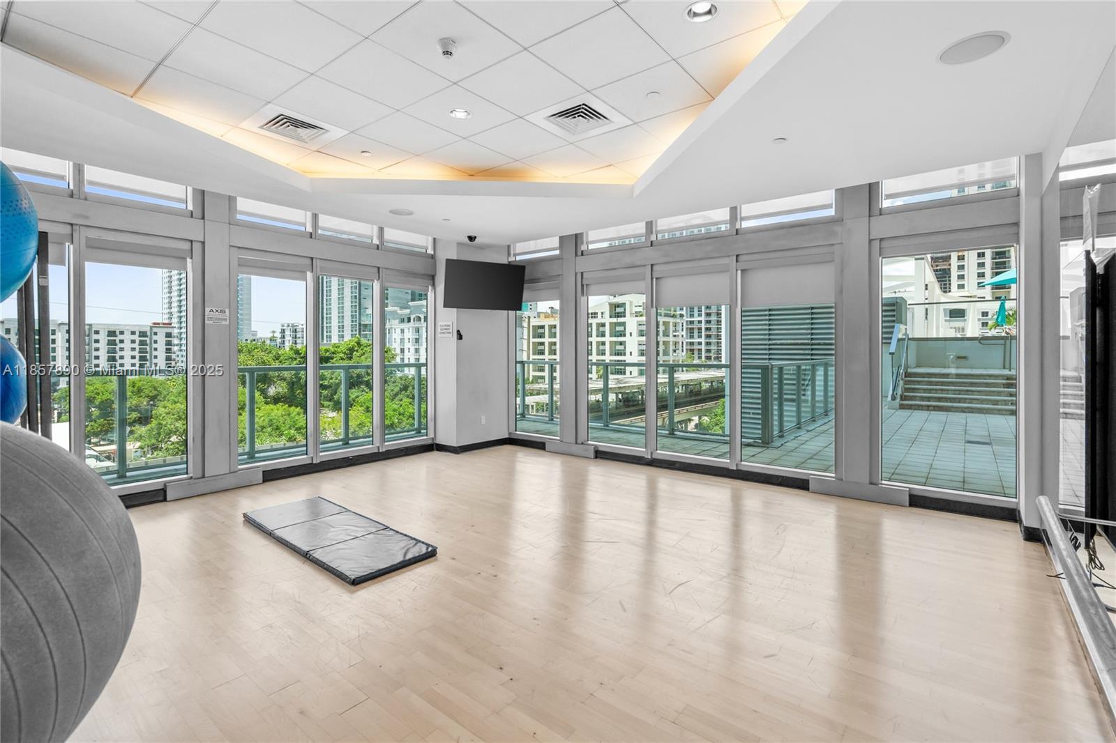 1111 Southwest 1st Avenue, Unit 2222N Miami, FL 33130 - Photo 47 of 53 a view of empty room with wooden floor and fan