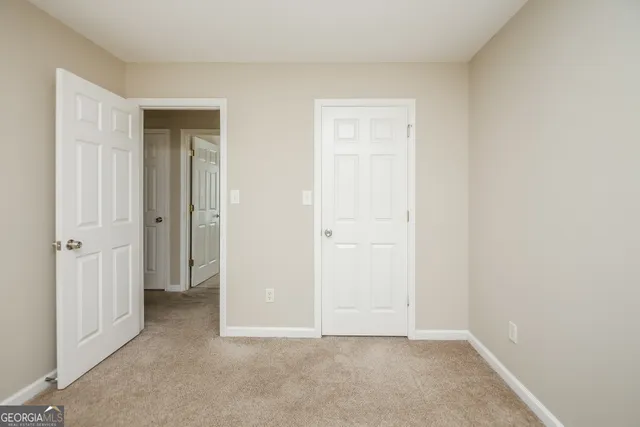an empty room with closet area