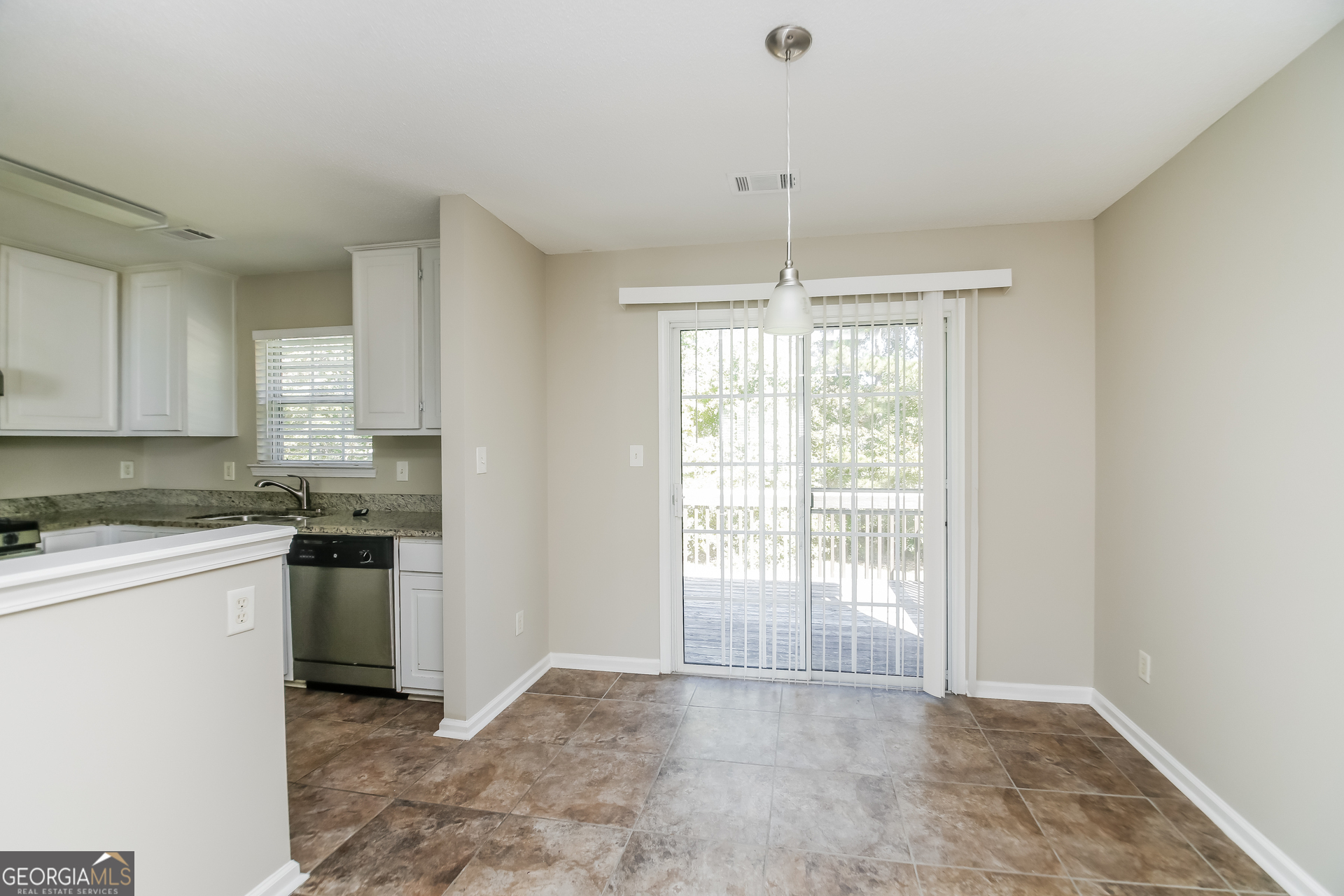 3775 Buffington Place Union City, GA 30291 - Photo 5 of 17 a kitchen with stainless steel appliances granite countertop a stove top oven a sink a counter space and cabinets