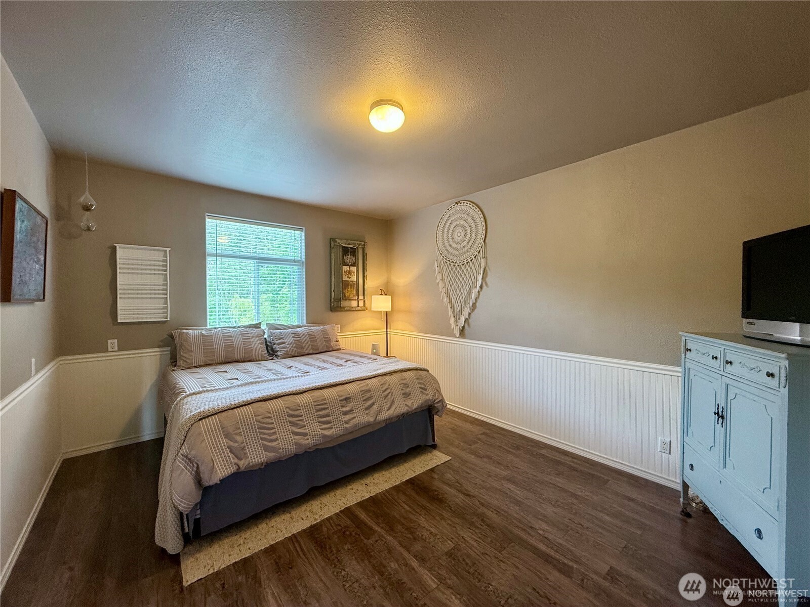 168 Jackson Road Orcas Island, WA 98245 - Photo 36 of 40 a bedroom with a bed and a flat screen tv