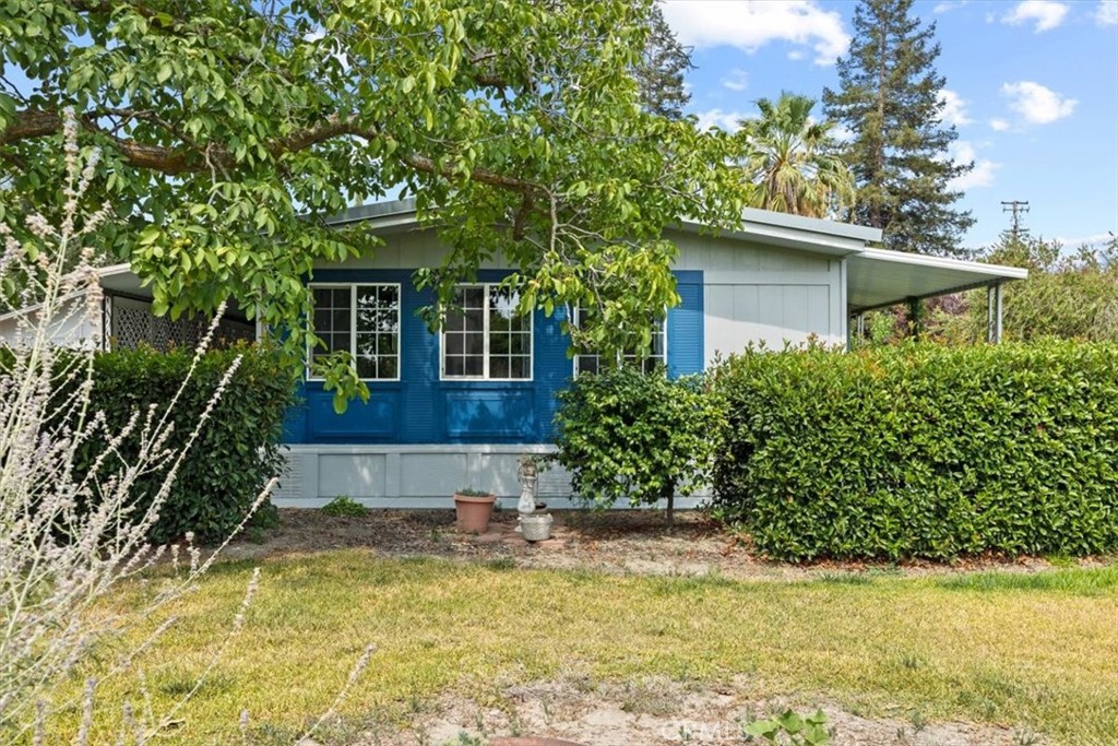 23184 Richfield Road Corning, CA 96021 - Photo 1 of 1 a front view of a house with a yard