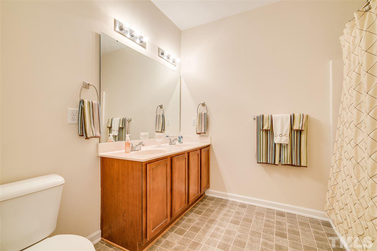3504 Pinkham Way Raleigh, NC 27616 - Photo 14 of 24 a bathroom with a sink a toilet and mirror