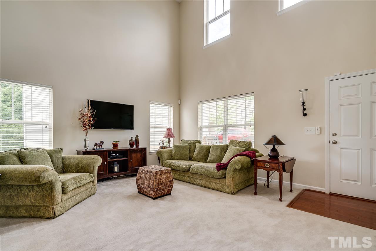 3504 Pinkham Way Raleigh, NC 27616 - Photo 4 of 24 a living room with furniture and a flat screen tv