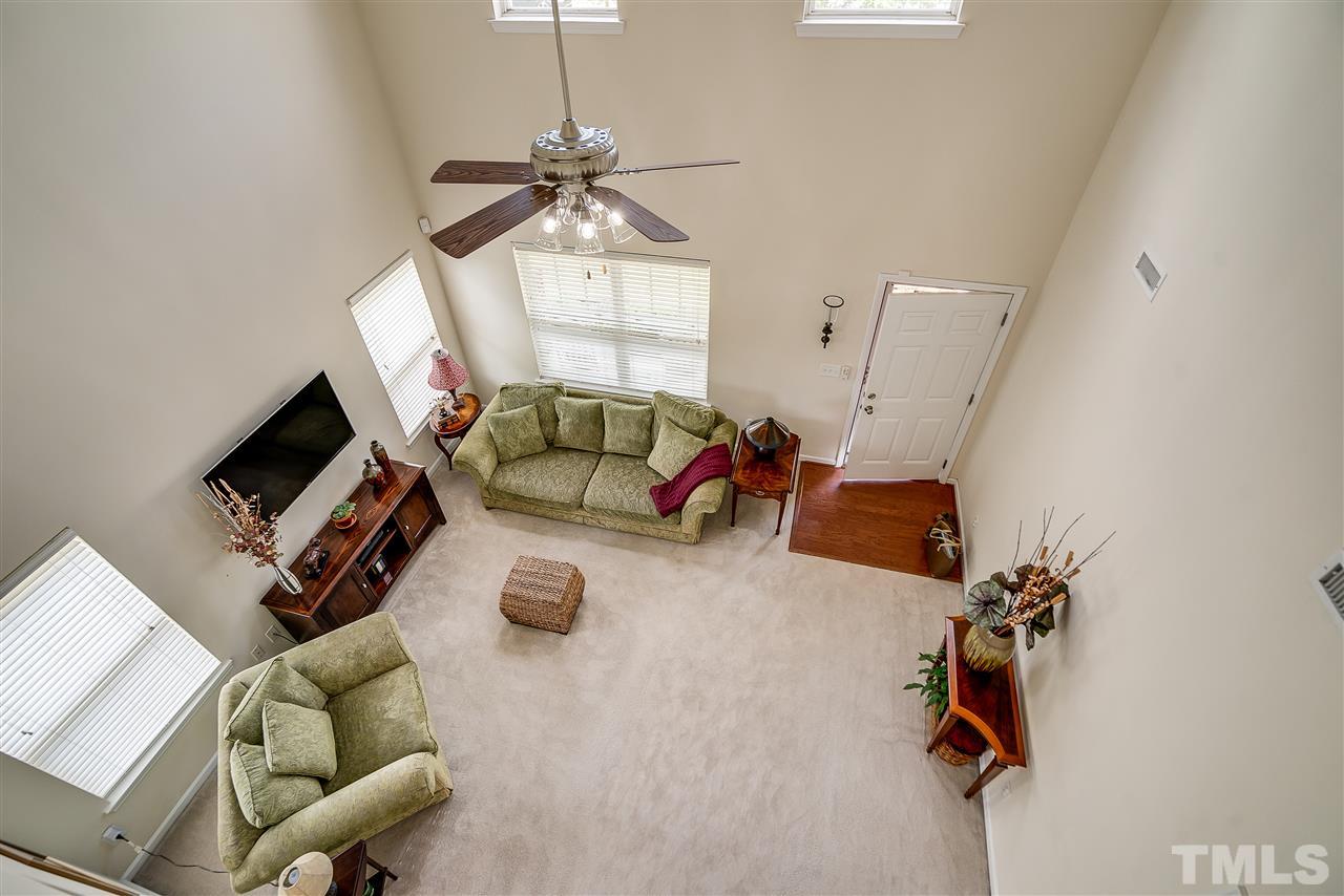 3504 Pinkham Way Raleigh, NC 27616 - Photo 5 of 24 a living room with furniture and a flat screen tv