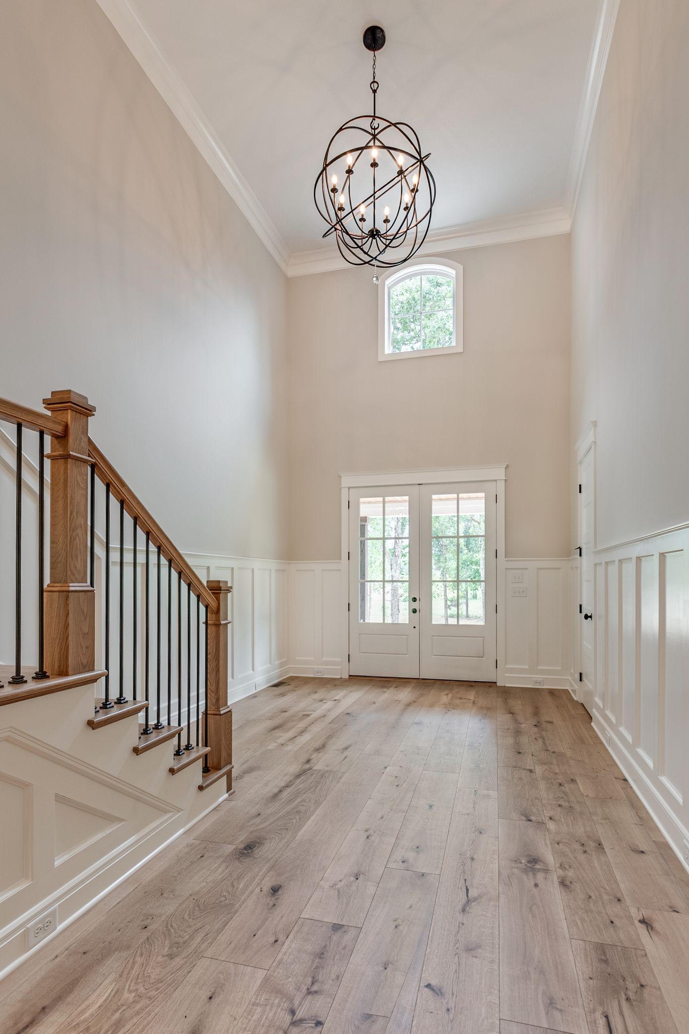 1635 Phillips Road Lebanon, TN 37087 - Photo 7 of 40 an empty room with wooden floor chandelier and windows