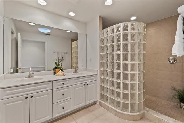 a bathroom with a double vanity sink and