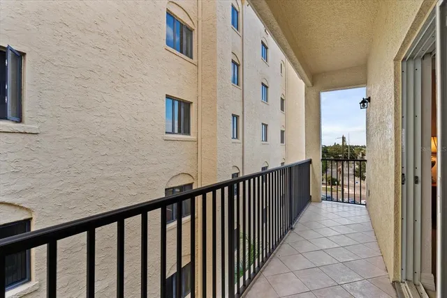 a view of a balcony with wooden floor
