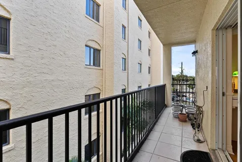 a view of a balcony with wooden fence