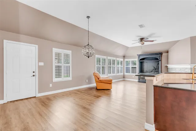 a view of living room with furniture and a window