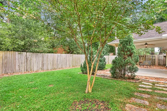 a view of a backyard with green space