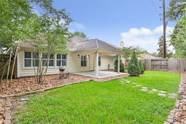 a view of a house with a yard porch and sitting area