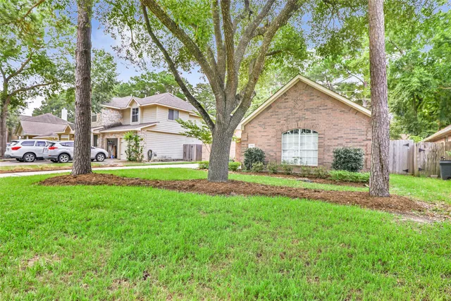a view of a house with a yard