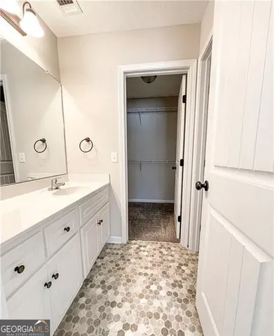 a bathroom with a sink and a mirror