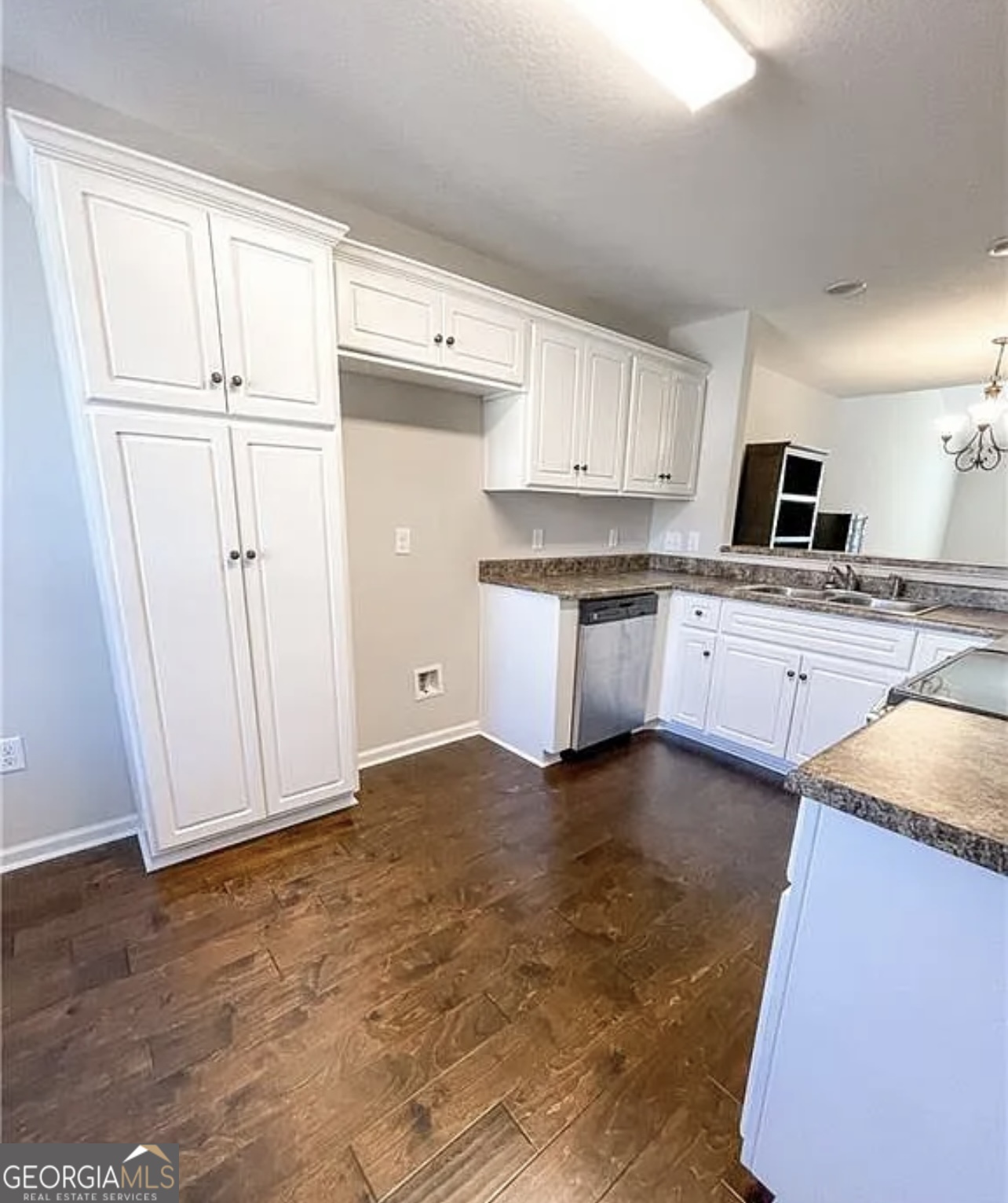 143 Buckhaven Way Statesboro, GA 30458 - Photo 4 of 14 a kitchen with granite countertop white cabinets and white appliances