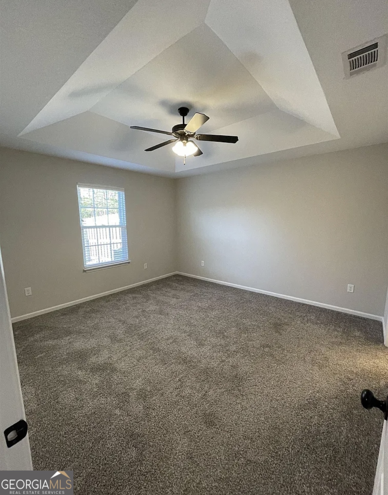 143 Buckhaven Way Statesboro, GA 30458 - Photo 8 of 14 an empty room with windows and ceiling fan