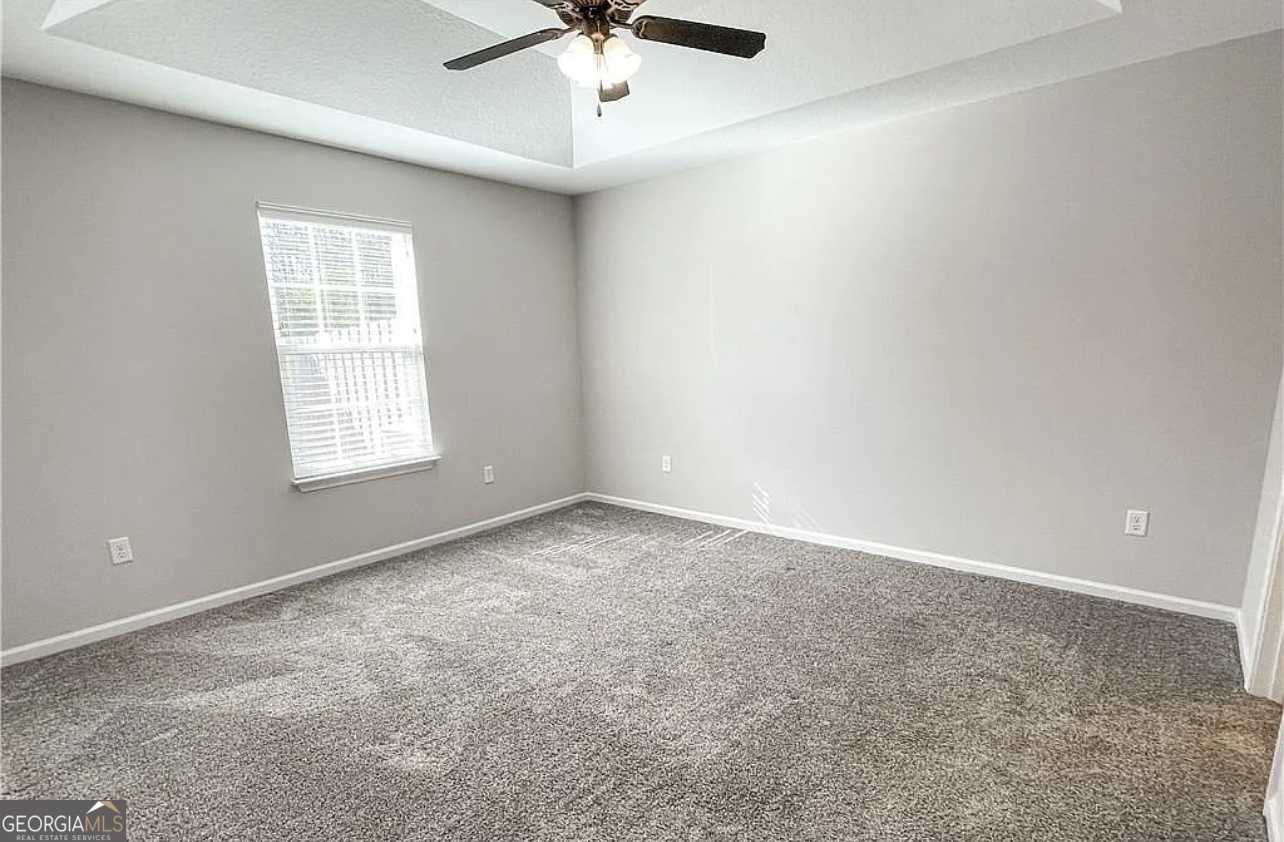 143 Buckhaven Way Statesboro, GA 30458 - Photo 9 of 14 an empty room with a window and a ceiling fan