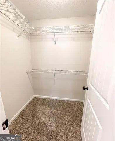 a view of a room with racks on the wall