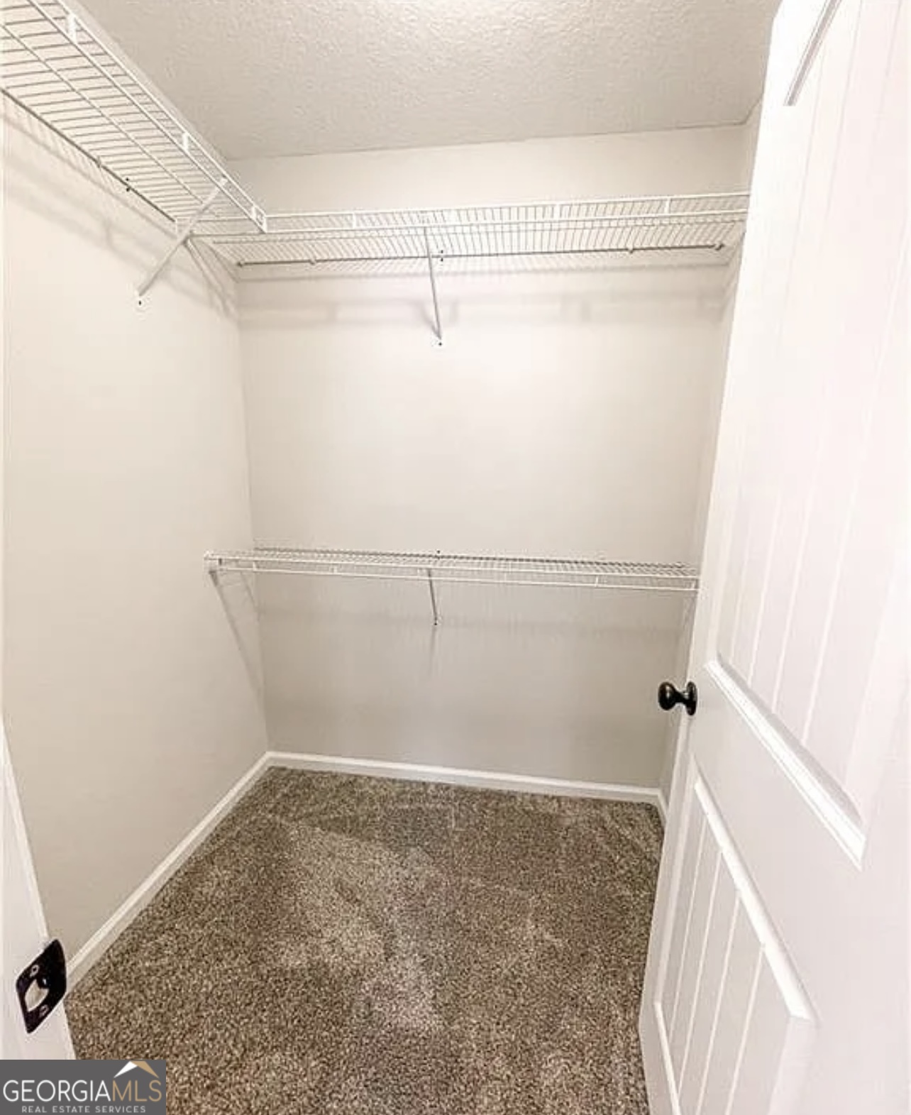 143 Buckhaven Way Statesboro, GA 30458 - Photo 10 of 14 a view of a room with racks on the wall