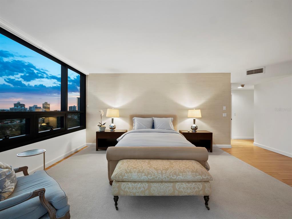 1255 North Gulfstream Avenue, Unit 408 Sarasota, FL 34236 - Photo 12 of 35 a bedroom with a large bed and a large window