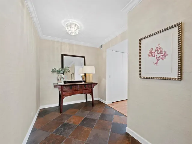 a view of room with furniture and wooden floor