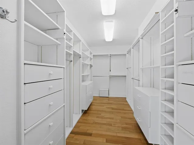 a view of a hallway with a white walls