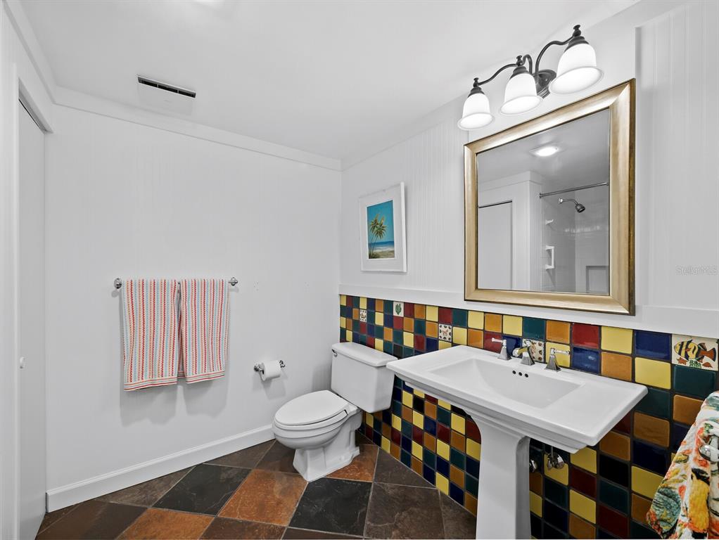 1255 North Gulfstream Avenue, Unit 408 Sarasota, FL 34236 - Photo 24 of 35 a bathroom with a sink and a mirror