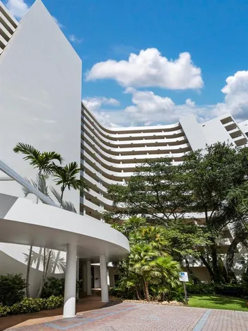 a view of a building and a yard