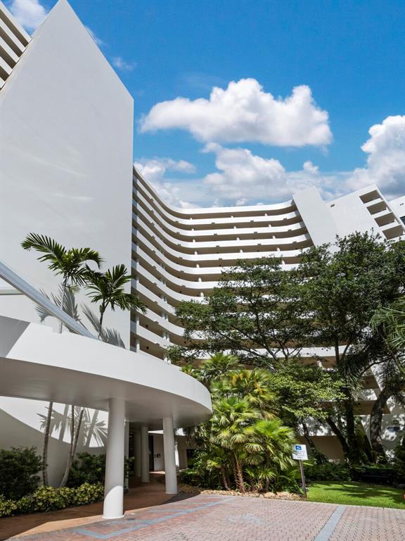 1255 North Gulfstream Avenue, Unit 408 Sarasota, FL 34236 - Photo 27 of 35 a view of a building and a yard