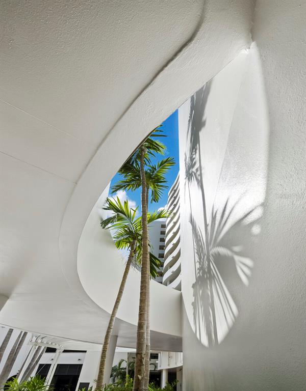 1255 North Gulfstream Avenue, Unit 408 Sarasota, FL 34236 - Photo 29 of 35 a vase of flowers sitting on a wall next to a white wall