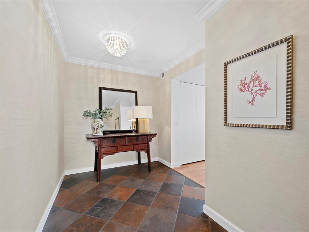 1255 North Gulfstream Avenue, Unit 408 Sarasota, FL 34236 - Photo 3 of 35 a view of room with furniture and wooden floor