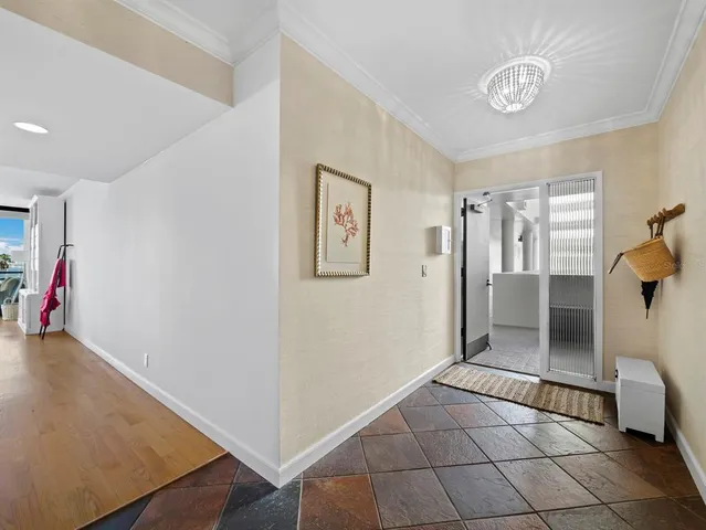 a view of a hallway view with staircase