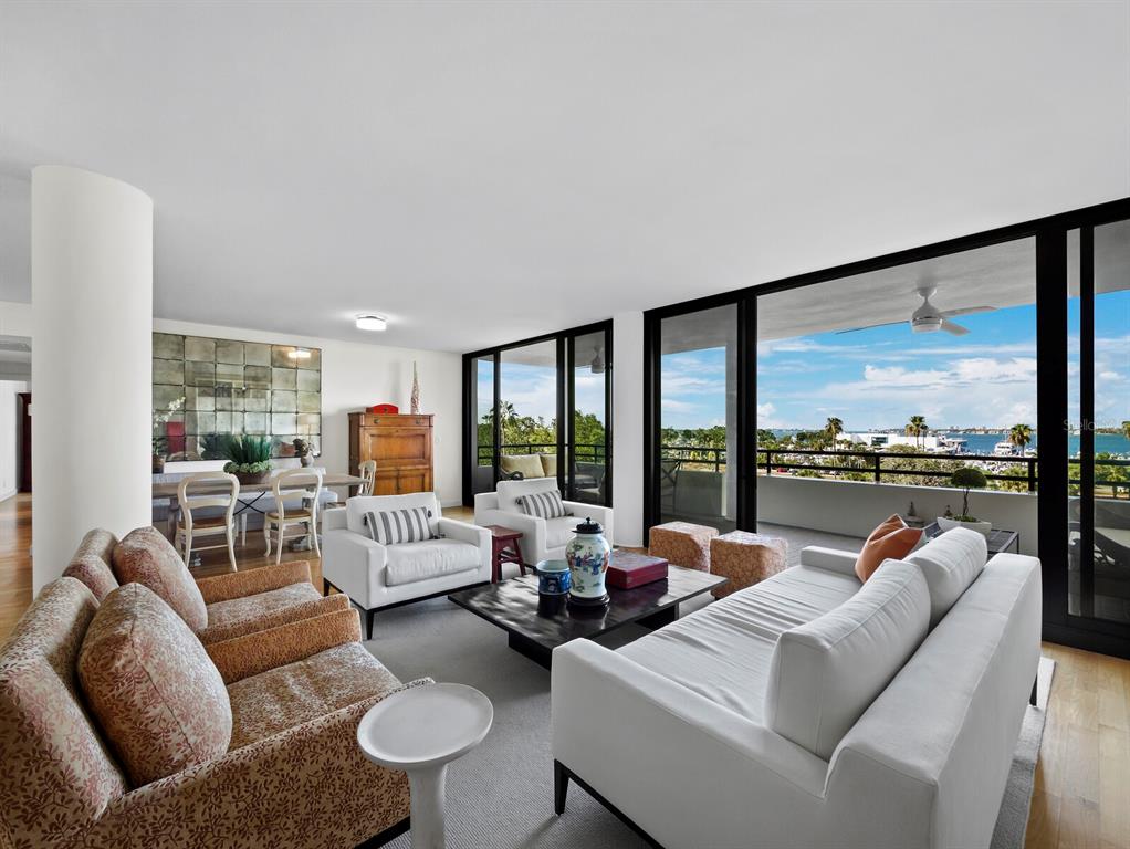 1255 North Gulfstream Avenue, Unit 408 Sarasota, FL 34236 - Photo 5 of 35 a living room with furniture and a large window