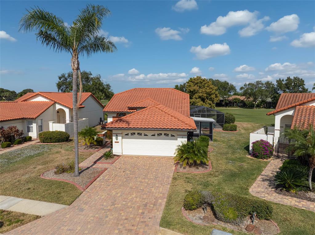 4934 Clubview Court East Bradenton, FL 34203 - Photo 1 of 44 a front view of a house with garden