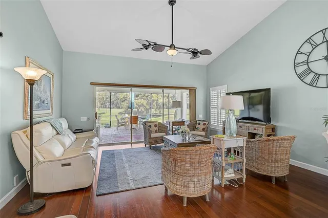 a living room with fireplace furniture and a flat screen tv