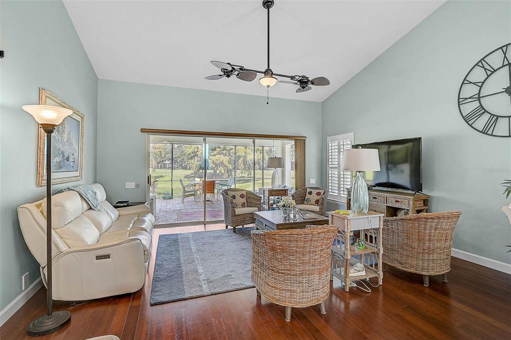4934 Clubview Court East Bradenton, FL 34203 - Photo 14 of 44 a living room with fireplace furniture and a flat screen tv