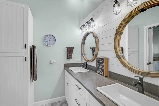 a bathroom with a sink and a mirror
