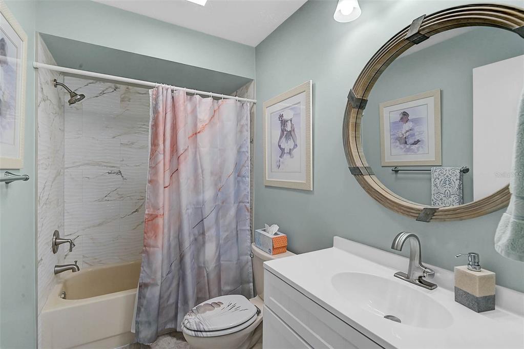 4934 Clubview Court East Bradenton, FL 34203 - Photo 23 of 44 a bathroom with a sink toilet and shower