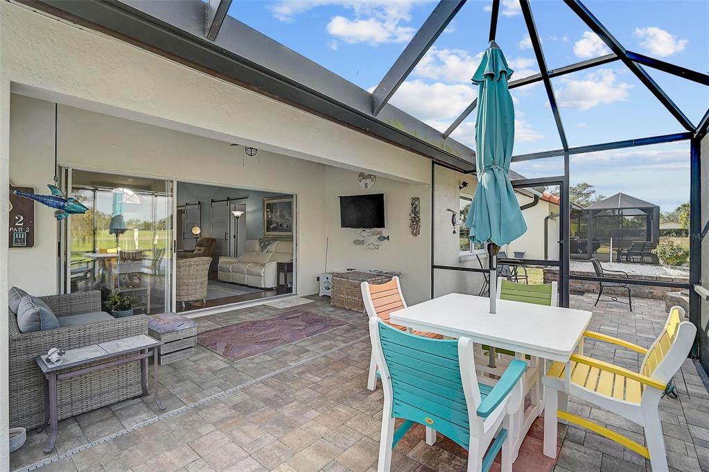 4934 Clubview Court East Bradenton, FL 34203 - Photo 29 of 44 a view of an outdoor dining space with furniture