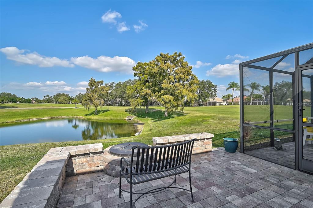 4934 Clubview Court East Bradenton, FL 34203 - Photo 35 of 44 a view of a lake with a garden