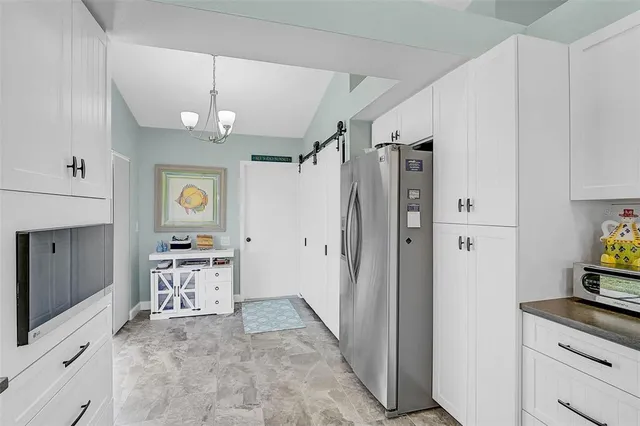 a view of a kitchen from the hallway