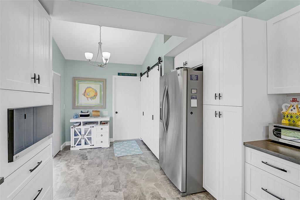 4934 Clubview Court East Bradenton, FL 34203 - Photo 5 of 44 a view of a kitchen from the hallway