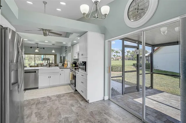 a kitchen with cabinets and a stove