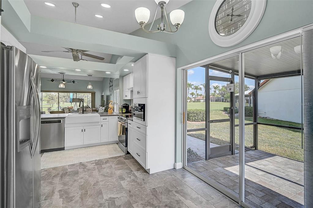 4934 Clubview Court East Bradenton, FL 34203 - Photo 8 of 44 a kitchen with cabinets and a stove