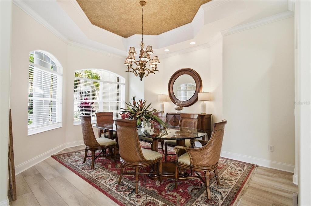 83 Front Street Palm Coast, FL 32137 - Photo 12 of 100 a view of a dining room with furniture and chandelier