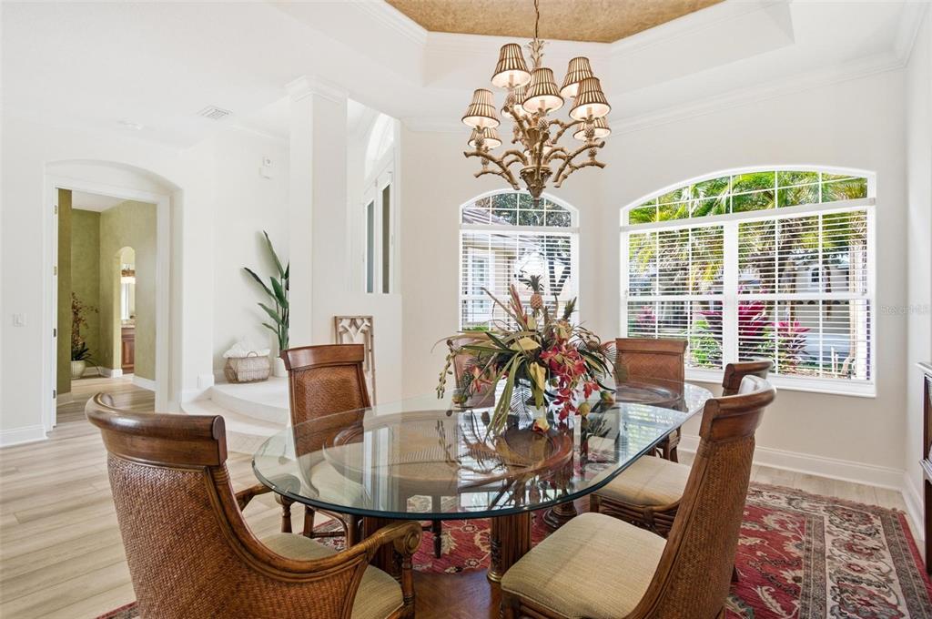 83 Front Street Palm Coast, FL 32137 - Photo 13 of 100 a view of a dining room with furniture a chandelier and wooden floor